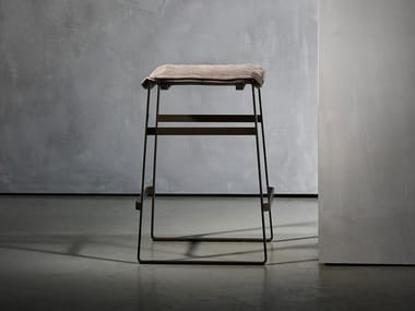 KEKKE LIVING - Upholstered sled base stool with footrest by Piet Boon