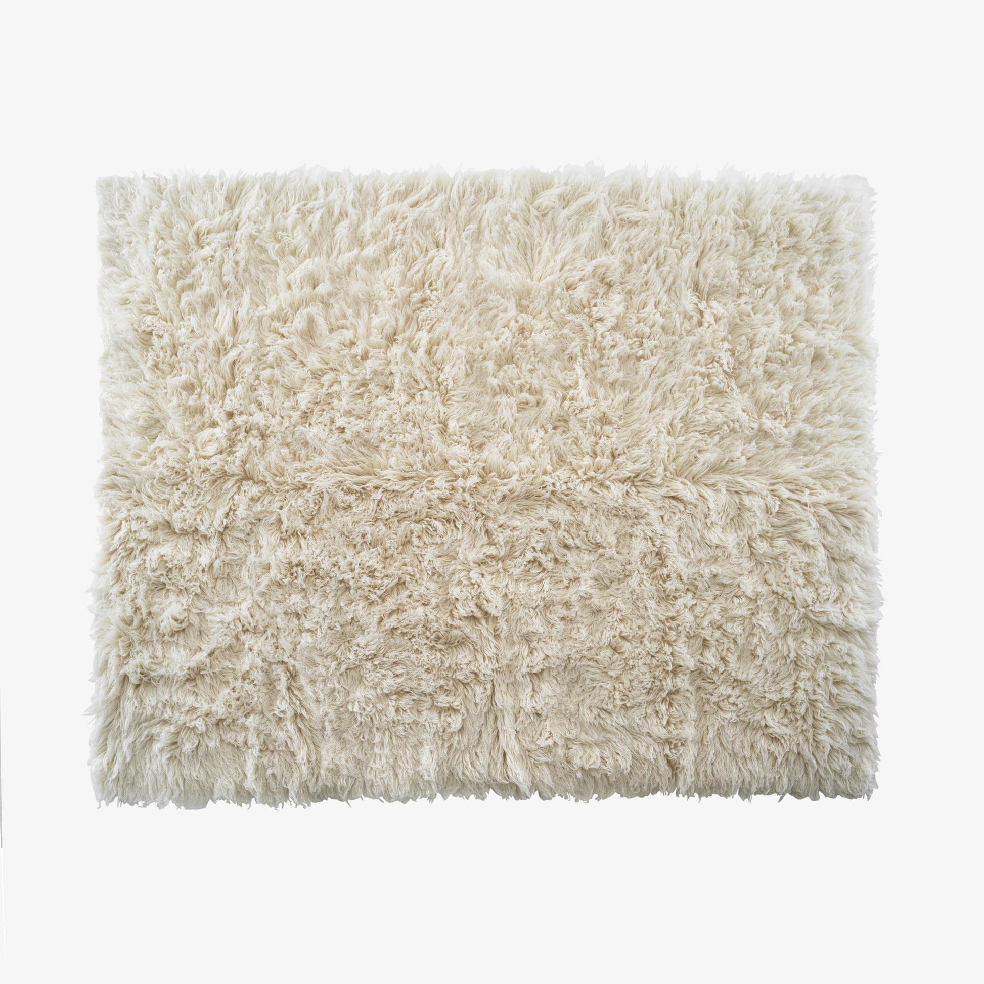 CHALI - Solid-color handmade rectangular wool rug.