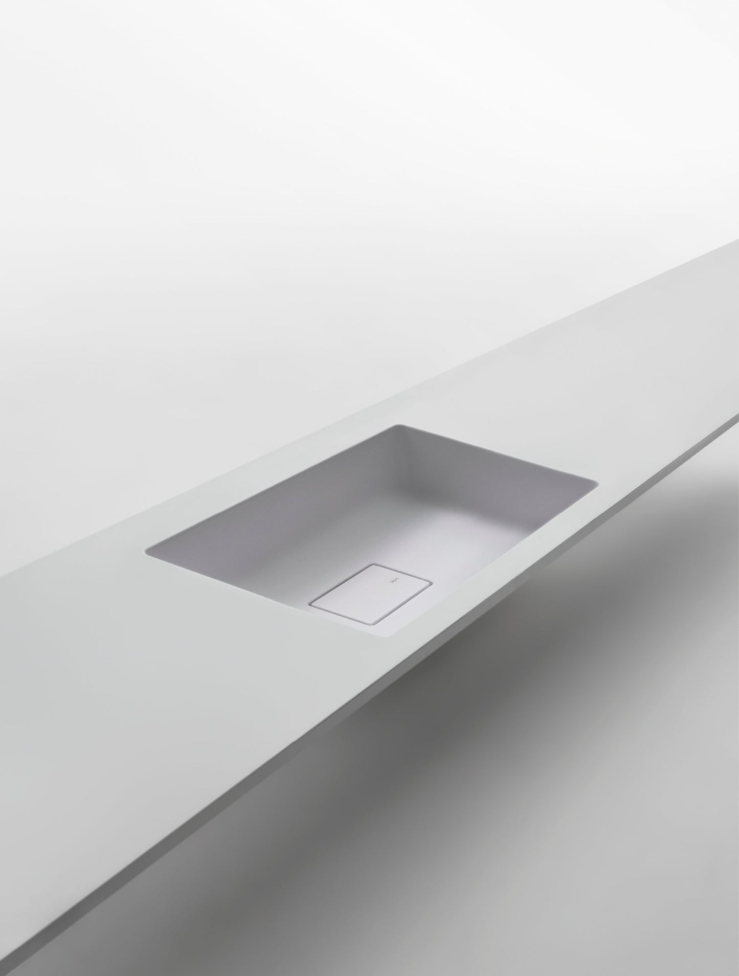 SHAPE H10 - Wall-mounted washbasin with integrated countertop by Falper