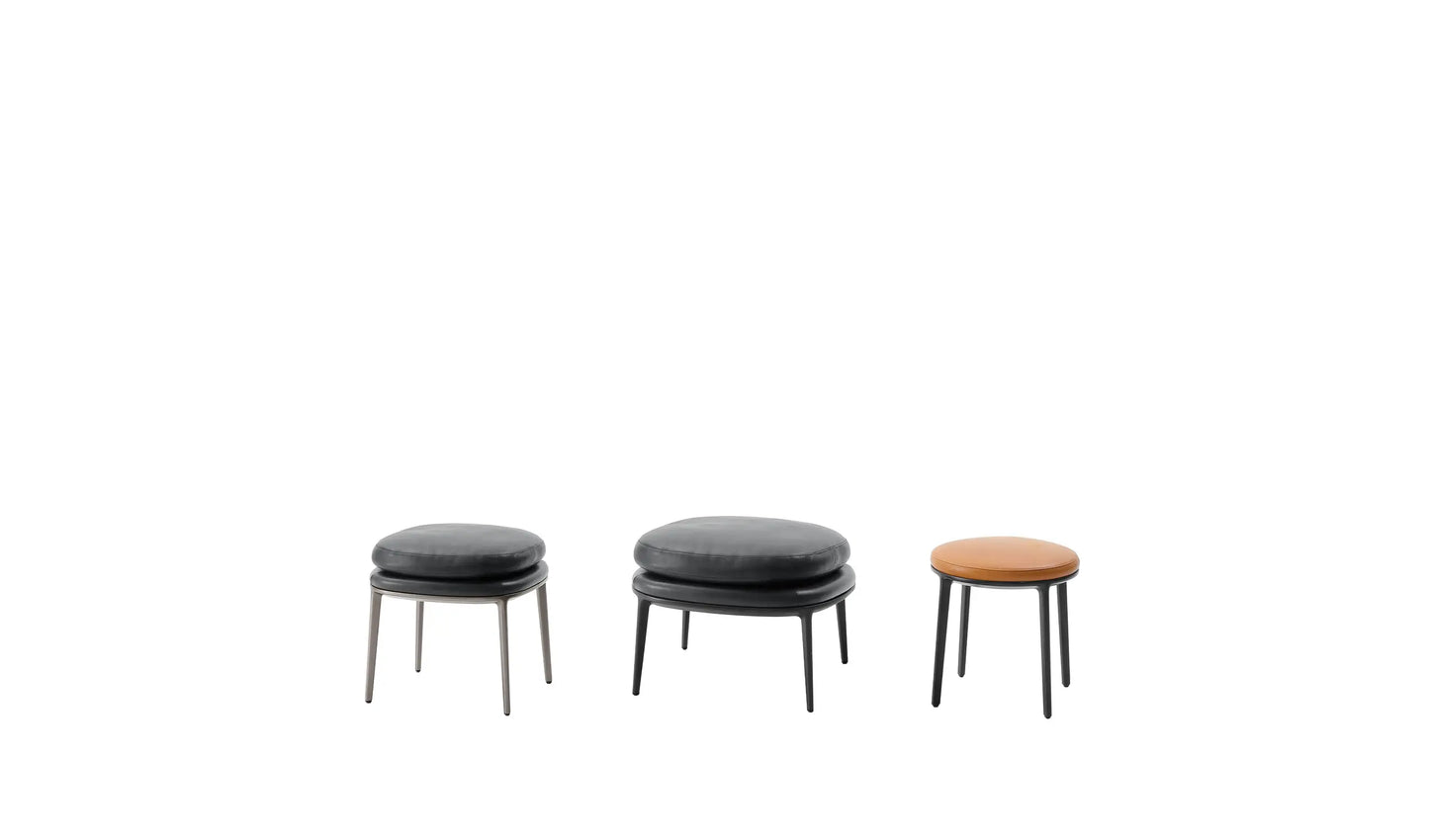 CARATOS - Upholstered round leather pouf.