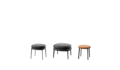 CARATOS - Upholstered round leather pouf.