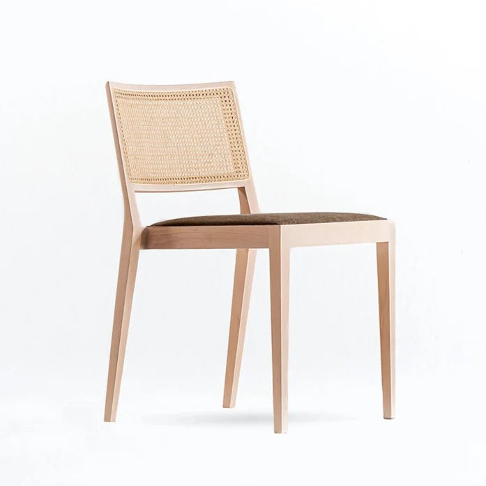 A CHAIR OUTSIDE THE CAGE - Beech chair with integrated cushion and cane backrest.