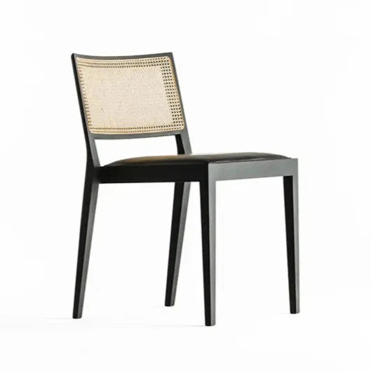 A CHAIR OUTSIDE THE CAGE - Beech chair with integrated cushion and cane backrest.