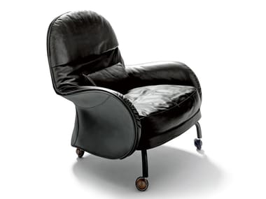 LOUISIANA - Upholstered tanned leather armchair with castors (Request Info).