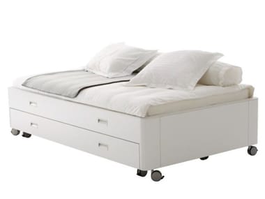 TRAVEL STUDIO - Wooden storage bed on castors (Request Info).